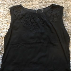 Sleeveless black blouse